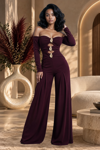 Bleu Hanger burgundy off-the-shoulder jumpsuit with gold hardware cutouts, long sleeves, and wide-leg trousers.
